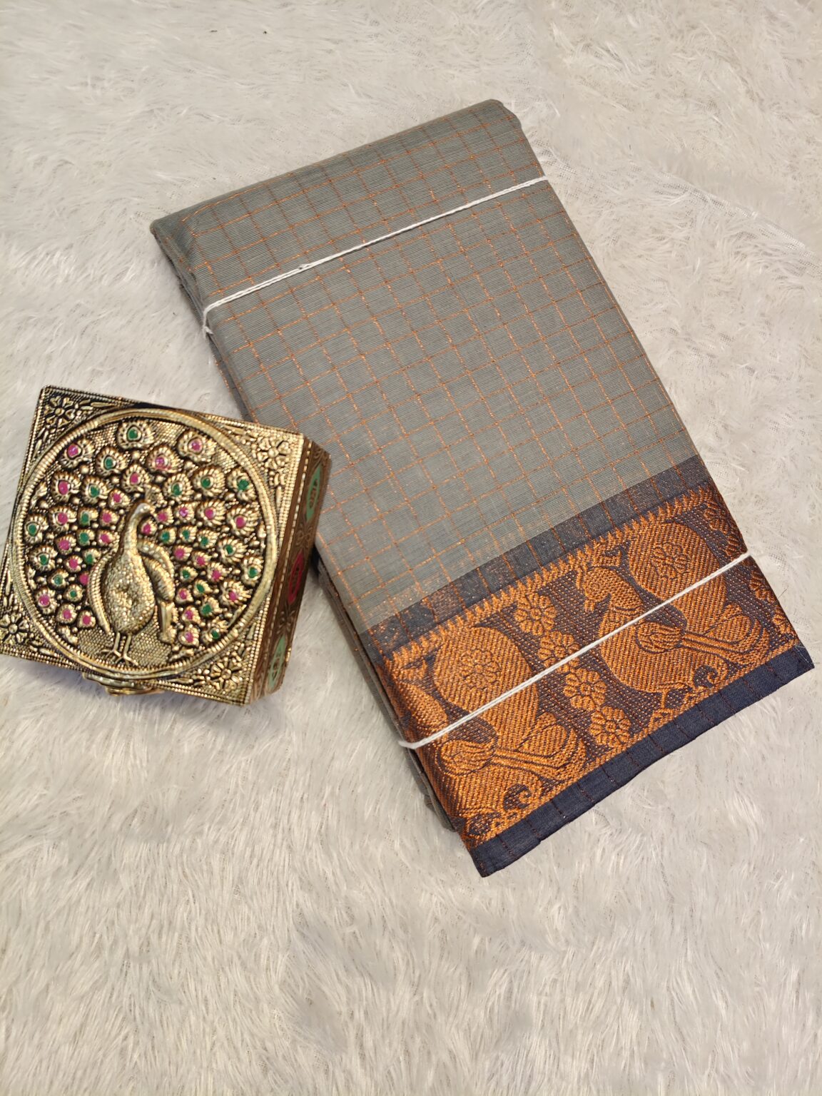 Natural grey golden zari checked body with rich golden zari contrast border, striped pallu.