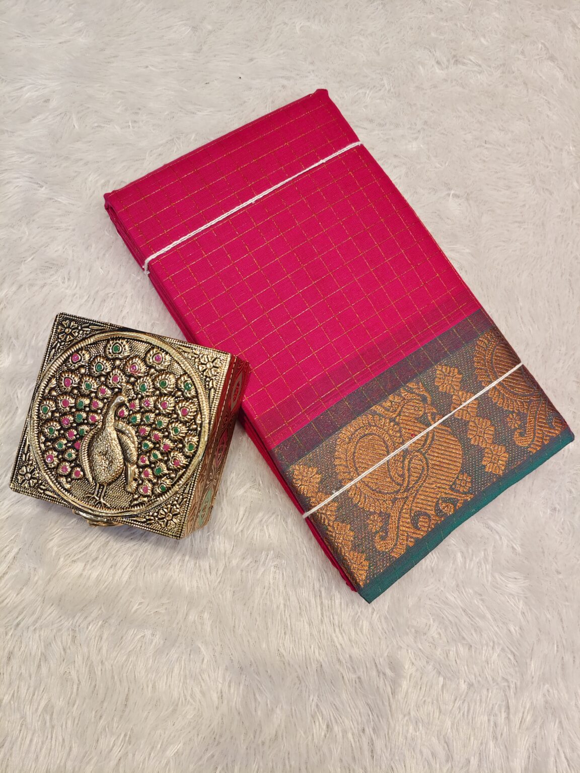 Raspberry golden zari checked body with rich golden zari contrast border, striped pallu.