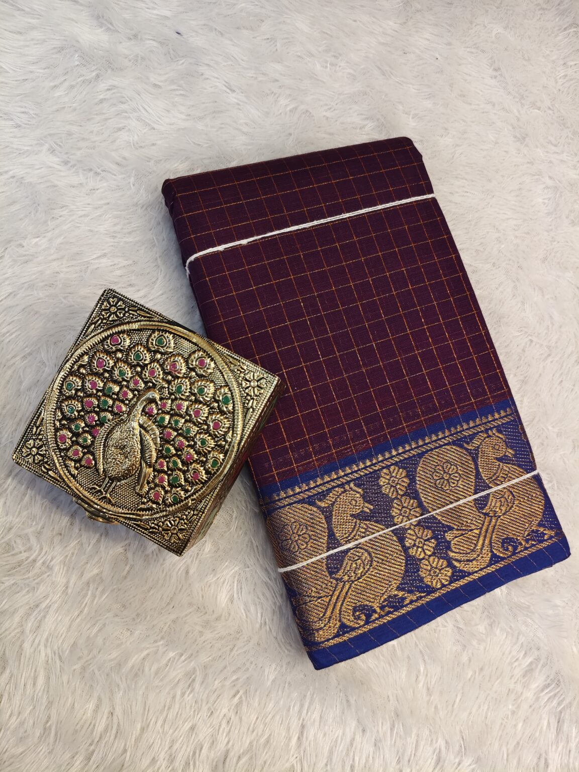 Cocoa bean golden zari checked body with rich golden zari contrast border, striped pallu.