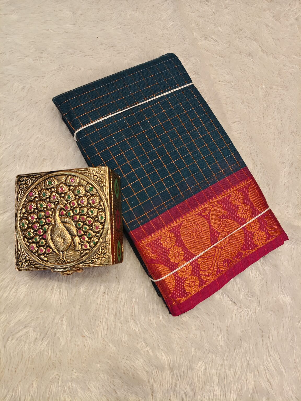 Rama green golden zari checked body with rich golden zari contrast border, striped pallu.